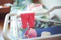 Panties and little baby cap in hospital cradle for newborns Royalty Free Stock Photo