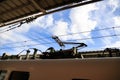 Pantograph of an electric train connecting the train to the overhead catenary wire Royalty Free Stock Photo