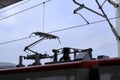 Pantograph of an electric train connecting the train to the overhead catenary wire Royalty Free Stock Photo