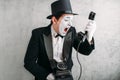 Pantomime actor performing with retro telephone Royalty Free Stock Photo