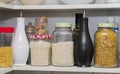 A pantry with storage jars rice jasmine pasta Royalty Free Stock Photo