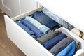 Pants folded according to the method of Marie Kondo. Vertical storage of clothes in a chest of drawers. Storage organization. Royalty Free Stock Photo