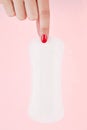 Pantyliner over pink. Royalty Free Stock Photo