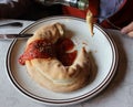 Panzerotti, closed pizza tasting with olive spicy oil in Italy