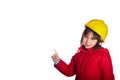 Paoramic format 4 year old girl smiling pointing a finger up towards a blank space with a yellow construction helmet looking at