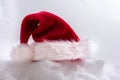 Papa Noel`s hat on snow background Royalty Free Stock Photo
