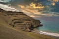 Papakoleagreen sand beach at sunset on Hawaii.