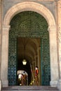 Papal Swiss guard standing at the Vatican Museum door