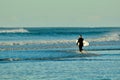 Papamoa Beach, Papamoa, New Zealand Ã¢â¬â July 07, 2019: an unidentified surfer preparing to enter the sea.