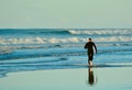 Papamoa Beach, Papamoa, New Zealand, July 07, 2019: an unidentified surfer preparing to enter the sea.