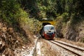 A diesel locomotive is leaving the Pengalat Tunnel between Kota Kinabalu and Papar