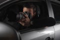 paparazzi doing surveillance by camera with lens from his Royalty Free Stock Photo