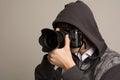 Paparazzi man taking picture with photo DSLR digital camera Royalty Free Stock Photo