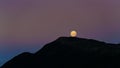 A full moon rising viewed from Ces Clarke hut. Paparoa Great Walk, south island, Aotearoa / New Zealand Royalty Free Stock Photo