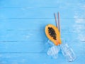 Papaya cut in half, glass jar and ice, concept of fresh fruit juice Royalty Free Stock Photo