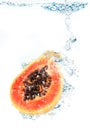 Papaya falling in water Royalty Free Stock Photo