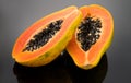 Papaya fruit on black background. Fresh organic Papaya exotic fruits close up. Healthy vegan papayas
