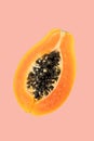 Papaya fruit on pink background. Half of fresh organic Papaya exotic fruit close up. Top view Royalty Free Stock Photo