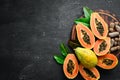 Papaya fruit on a wooden background. Tropical Fruits. Top view. Royalty Free Stock Photo