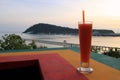 The papaya juce with view on the sunset beach.