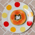 Papaya on plate square. Royalty Free Stock Photo