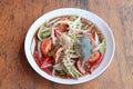 Papaya salad with crab in the white dish