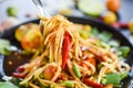 Papaya salad on a fork / Close up of green papaya salad spicy thai food on the table selective focus , Som tum Thai