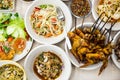 Papaya salad, grilled chicken and Sai krok isan Thai food