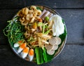 A papaya salad and mixed refreshing vegetables with boiled eggs on the black dish photo taken from the top view. Thailand local fo Royalty Free Stock Photo