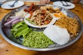 Papaya Salad on tray, with roasted pork, rice noodles, shrimp pork, boiled egg, fried Vietnamese sausage Royalty Free Stock Photo
