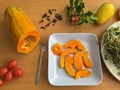 Papaya slices on plate, mango and tomatoes Royalty Free Stock Photo