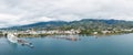 Papeete city, island of Tahiti, French Polynesia. Aerial view of city skyline, sea port and marine.