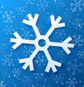 Paper abstract snowflake on blue background