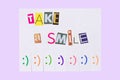 A paper ad with the phrase: Take a Smile and with smile signs ready to be tore off