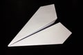 Paper airplane on a dark background for design and flight of fantasies Royalty Free Stock Photo