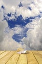 Paper airplane on a wooden platform. Royalty Free Stock Photo