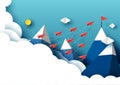 Paper airplanes flying to red flag on the peak of blue mountain Royalty Free Stock Photo