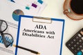 Paper with Americans with Disabilities Act ADA on the table Royalty Free Stock Photo