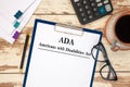 Paper with Americans with Disabilities Act ADA on the table