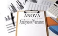 Paper with ANOVA ANALYSIS OF VARIANCE on chart background