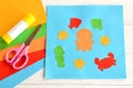 Paper applique with sea animals and fishes. Art lesson in kindergarten. Sheets of colored paper, scissors, glue Royalty Free Stock Photo