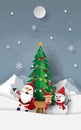 Paper art, Craft style of Santa Claus with friends with Christmas tree at snow mountain Royalty Free Stock Photo