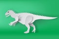 Paper art of Indominous Rex dinosour on green background Royalty Free Stock Photo