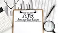 Paper with ATR Average True Range a table on charts, business concept