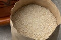 Paper bag with barley grits close up