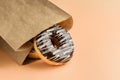 Paper bag with chocolate donuts close-up Royalty Free Stock Photo