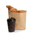 Paper bag with croissants and cup of coffee on white. Space for design Royalty Free Stock Photo