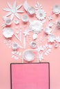 Paper bag of different paper flower on a pink background. Shopping.