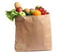 Paper bag with different groceries on white Royalty Free Stock Photo