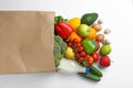 Paper bag with different groceries on white, top view Royalty Free Stock Photo